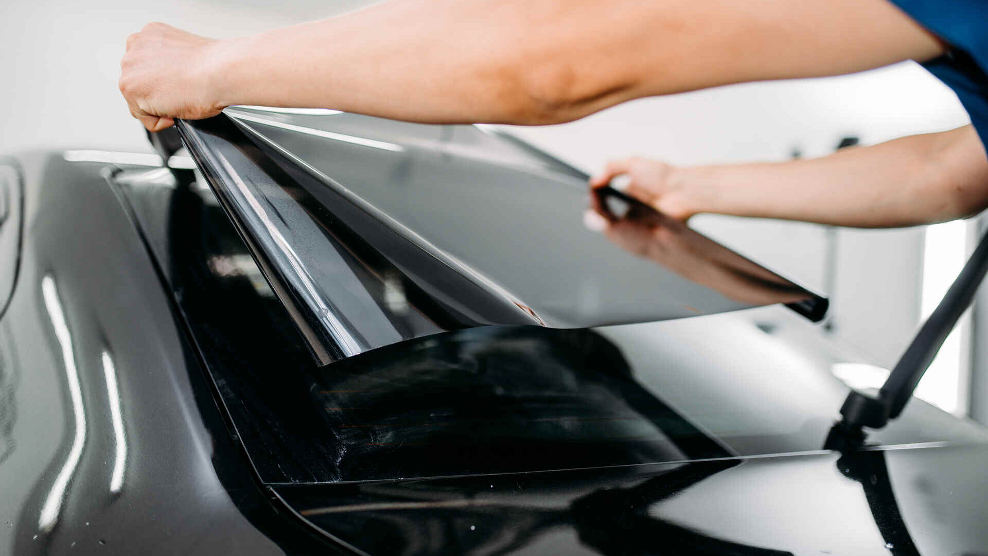 Ceramic window tint being installed on a car in NJ